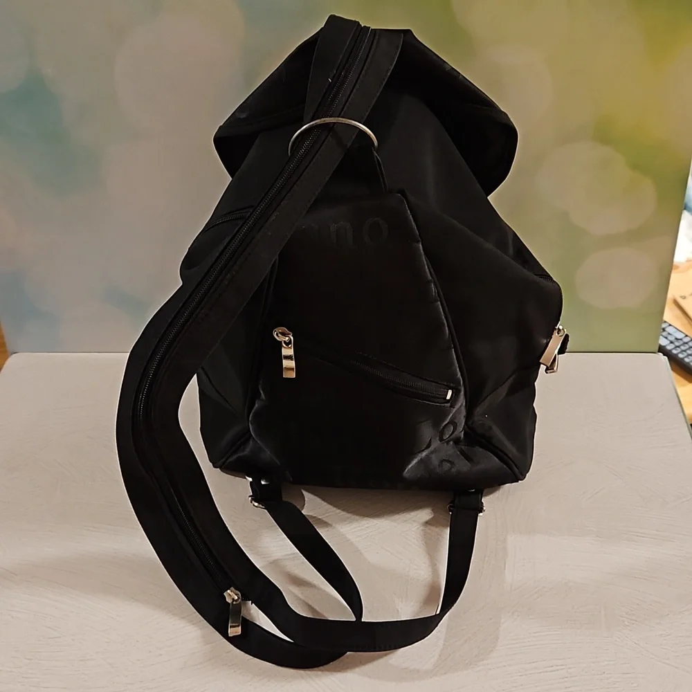 Black backpack convertible bag international city names on sections EUC